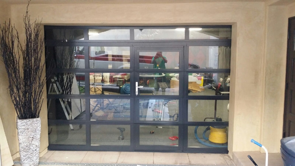 Contemporary Aluminum & Clear Tempered Glass Garage Door