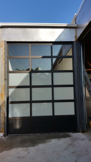 Contemporary Black Aluminum & White Laminate (Privacy) Glass Garage Door
