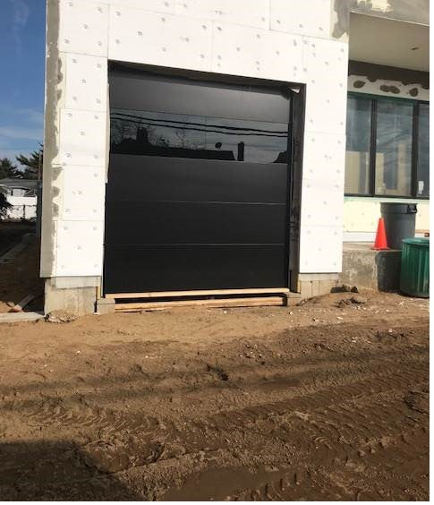 Infinity - Flush Panel Smooth Steel Garage Door with Horizontal Modern Glass Design