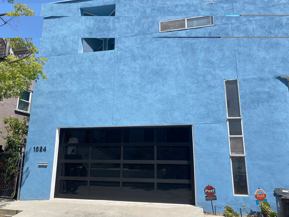 Contemporary Black Aluminum & Black Laminate (Privacy) Glass Garage Door