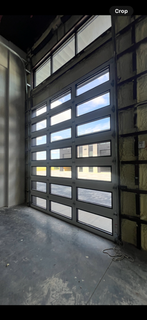 Infinity - Flush Panel Smooth Steel Garage Door with Horizontal Modern Glass Design