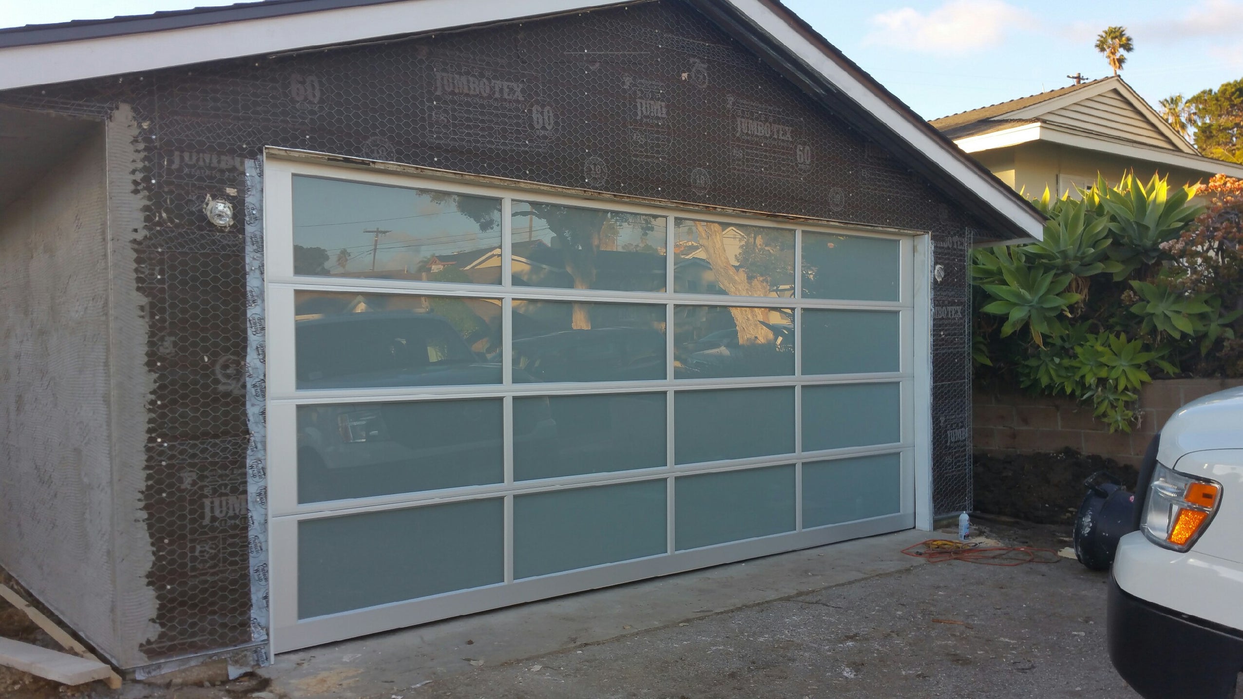 Contemporary Aluminum & White Laminate (Privacy) Glass Garage Door