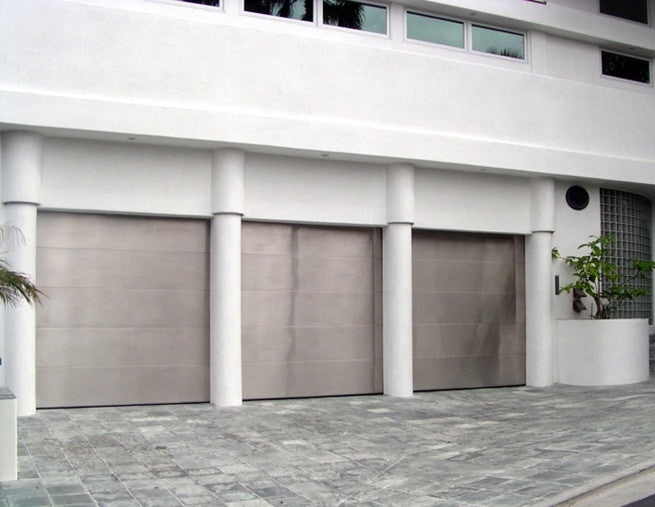 Grand - Modern Style Custom Wood Garage Door with Stainless Steel Overlay