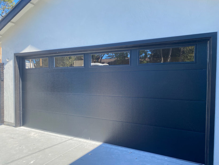 Mundo - Flush Panel Steel with a Natural Wood-Grain Texture Garage Door and Vertical Windows